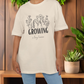Oversized T-Shirt zur Schwangerschaftsverkündung "Growing a tiny human"